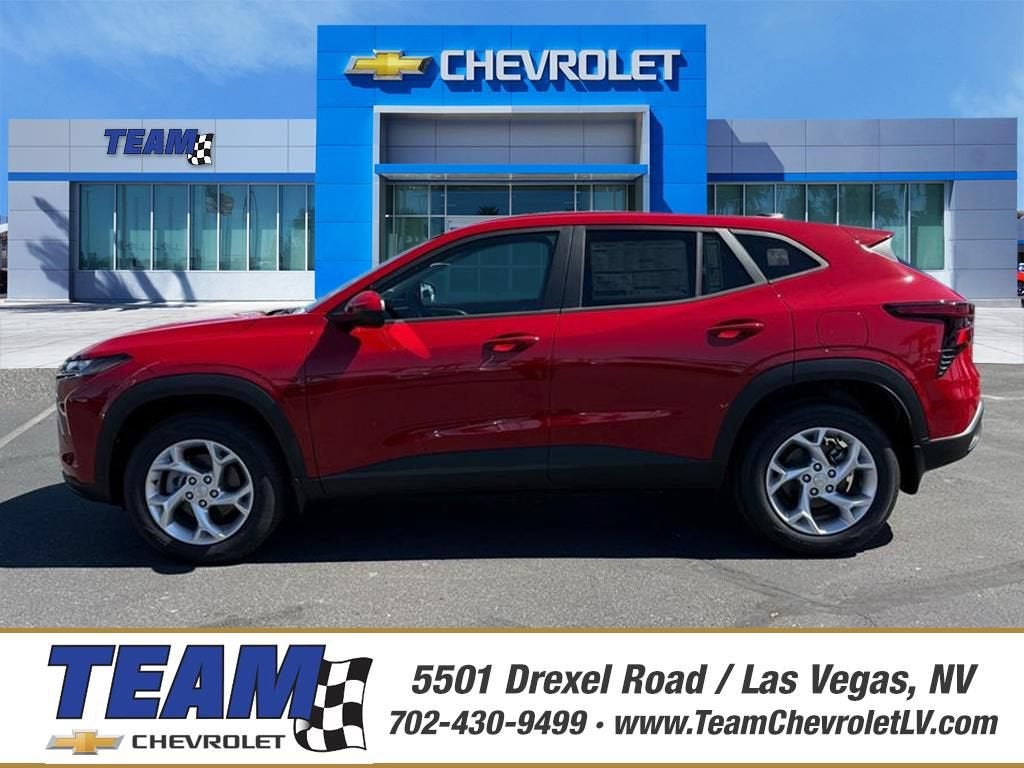 2026 Chevrolet Trax LS in Apex Red — front three-quarter view