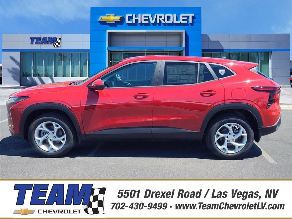 2026 Chevrolet Trax LS in Apex Red — front three-quarter view